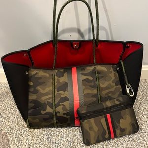 Haute Shore Greyson Tote. Green camo with olive/black/red stripe.